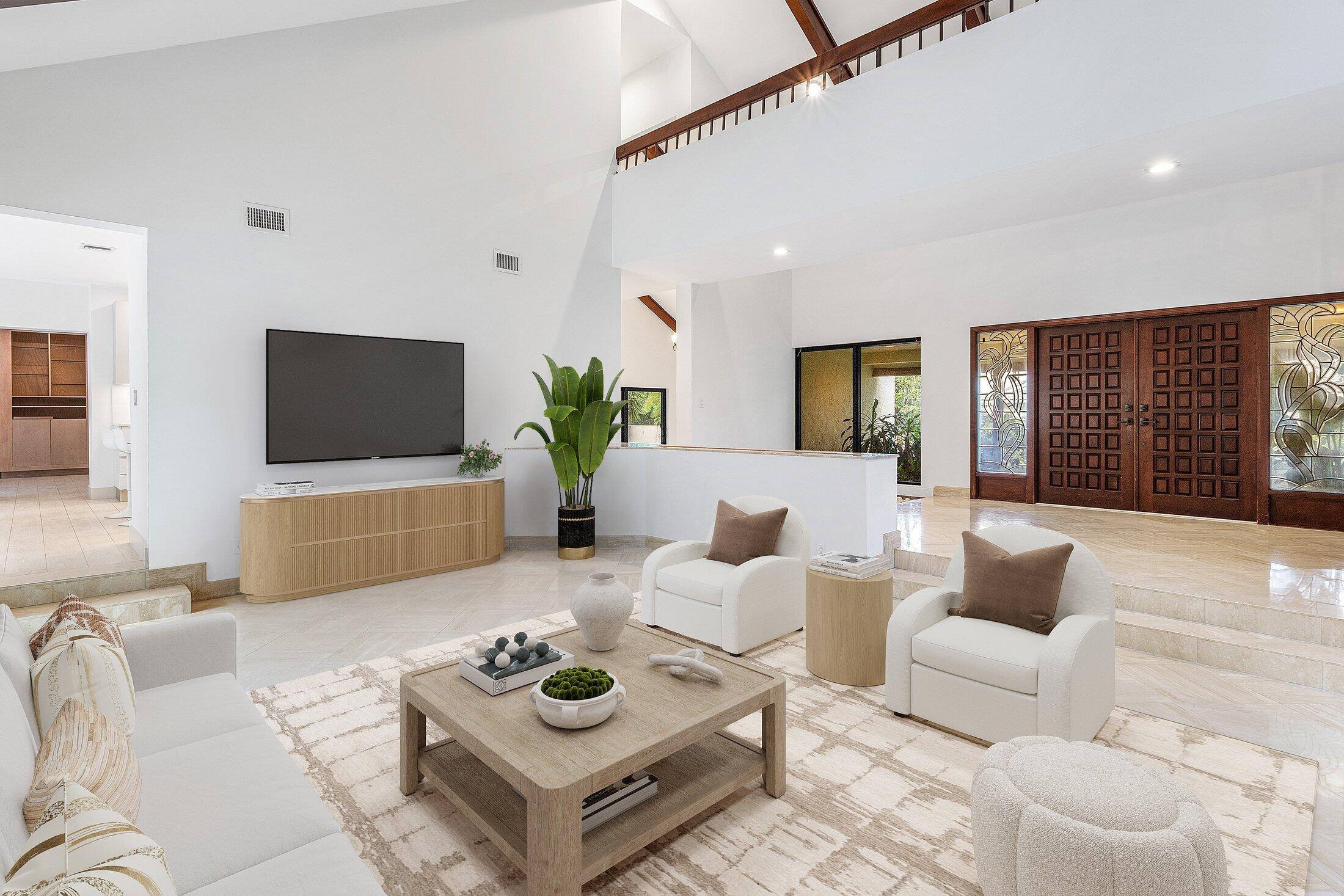 4140 Sanctuary Lane Boca Raton, FL 33431 - Photo 10 of 94 a living room with furniture a flat screen tv and a large window