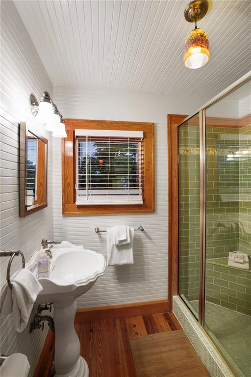 702 Pass A Grille Way St. Pete Beach, FL 33706 - Photo 31 of 41 a bathroom with a sink and a mirror