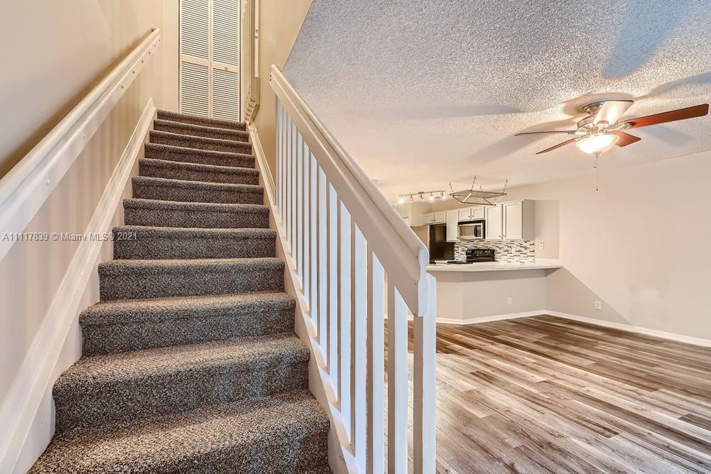 339 Timberwalk Trail Jupiter, FL 33458 - Photo 15 of 33 a view of entryway and hall with wooden floor