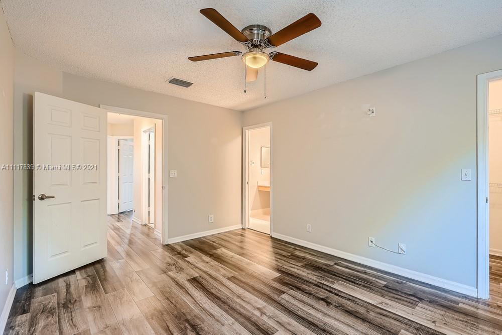 339 Timberwalk Trail Jupiter, FL 33458 - Photo 18 of 33 a view of empty room with wooden floor