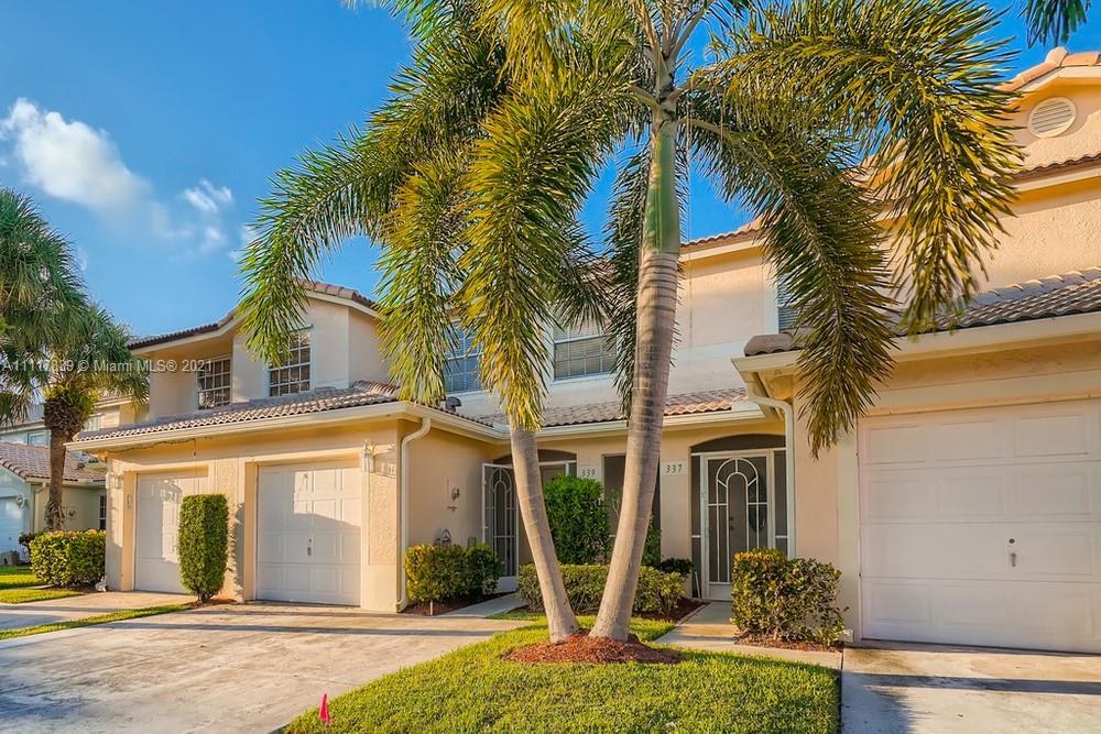 339 Timberwalk Trail Jupiter, FL 33458 - Photo 3 of 33 a front view of a house with garden