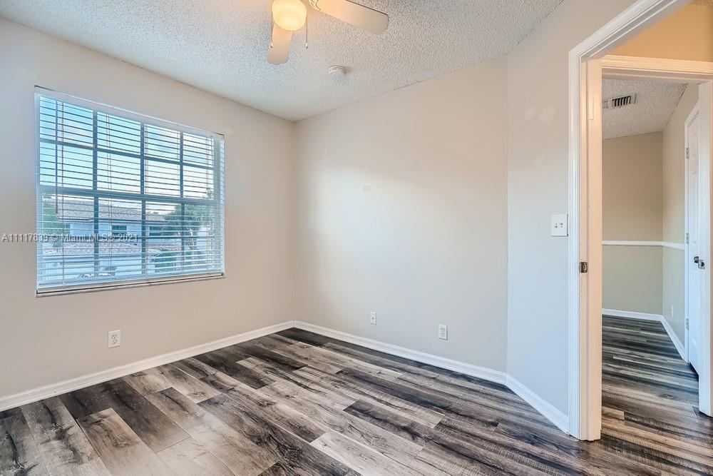 339 Timberwalk Trail Jupiter, FL 33458 - Photo 25 of 33 a view of a room with wooden floor and staircase
