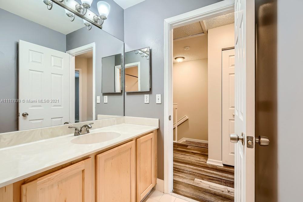 339 Timberwalk Trail Jupiter, FL 33458 - Photo 27 of 33 a bathroom with a sink double vanity and a mirror