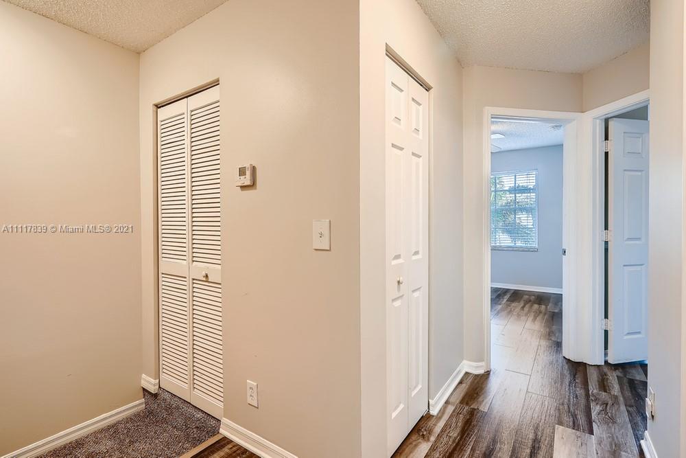 339 Timberwalk Trail Jupiter, FL 33458 - Photo 28 of 33 a view of a hallway with wooden floor and staircase