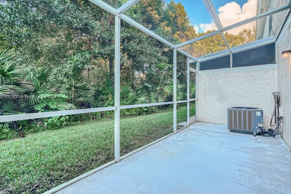 339 Timberwalk Trail Jupiter, FL 33458 - Photo 29 of 33 a view of a backyard with a garden and plants