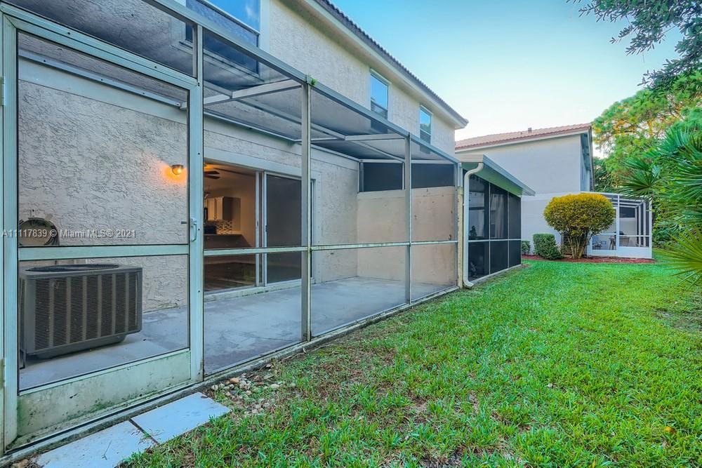 339 Timberwalk Trail Jupiter, FL 33458 - Photo 31 of 33 a view of a backyard with a garden