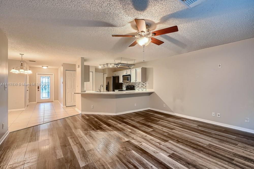 339 Timberwalk Trail Jupiter, FL 33458 - Photo 6 of 33 a view of a living room a window and a ceiling fan