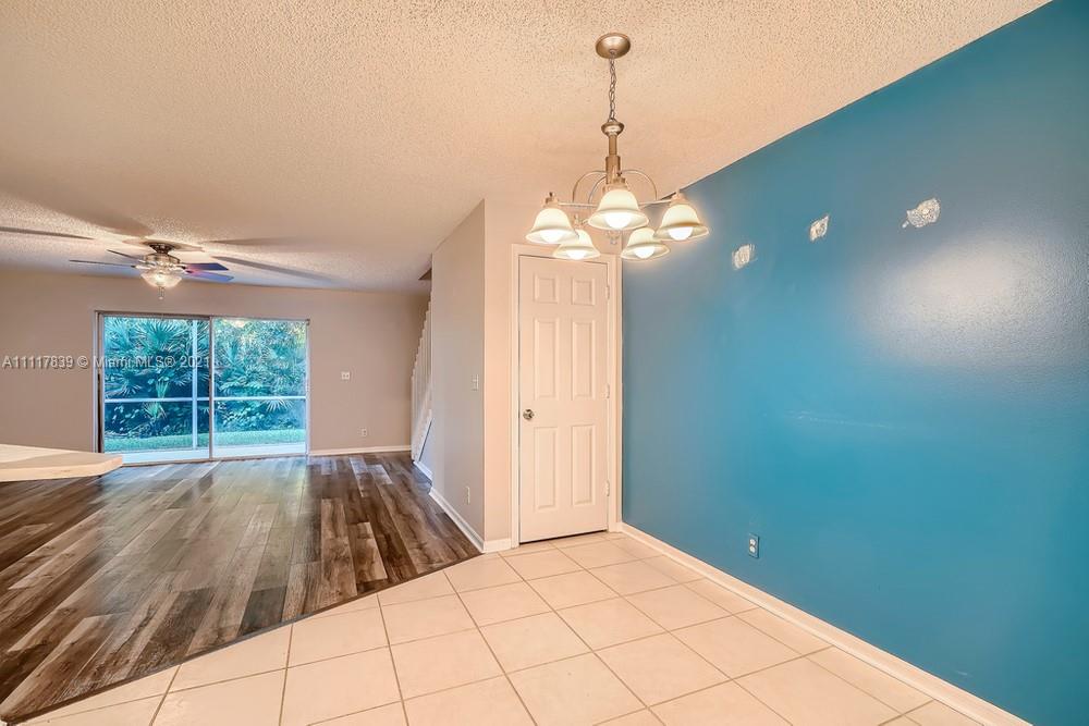 339 Timberwalk Trail Jupiter, FL 33458 - Photo 9 of 33 a view of a livingroom with a chandelier