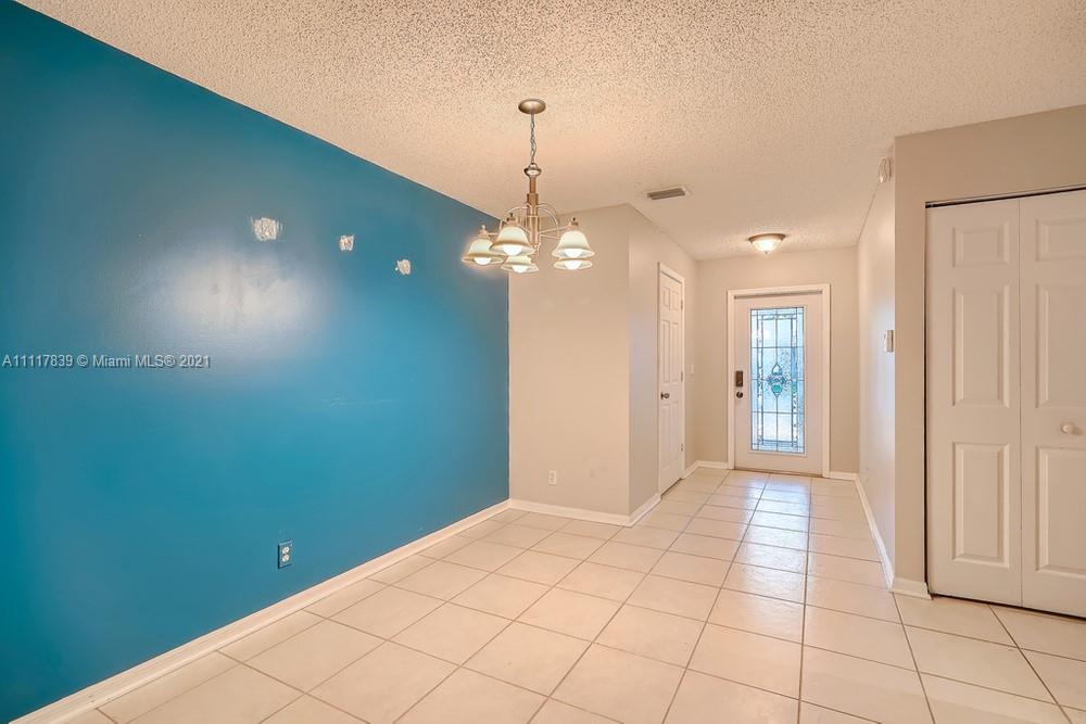 339 Timberwalk Trail Jupiter, FL 33458 - Photo 10 of 33 a view of a room with window and stairs