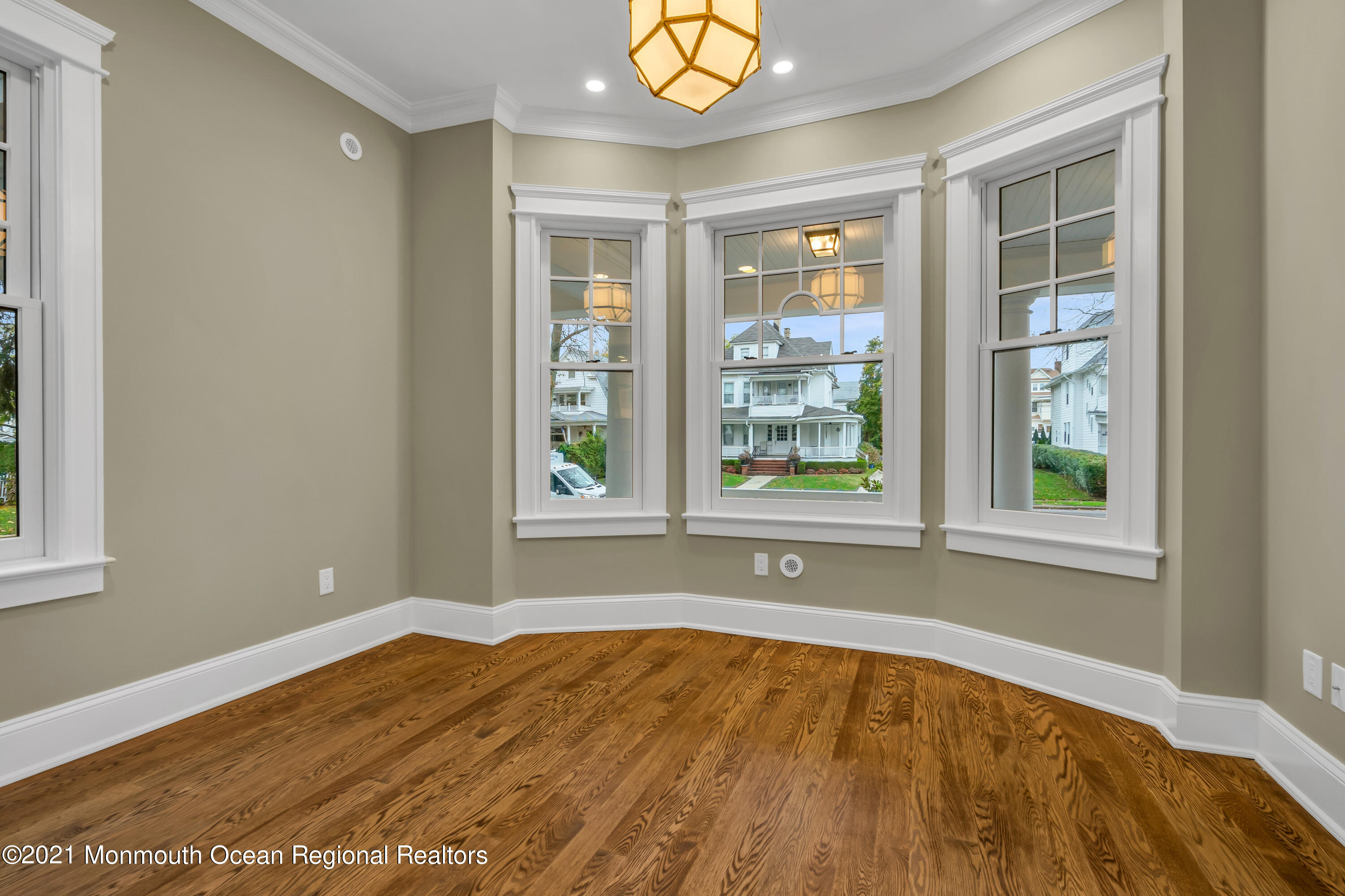 222 Cedar Avenue Allenhurst, NJ 07711 - Photo 14 of 73 a view of empty room with window and wooden floor