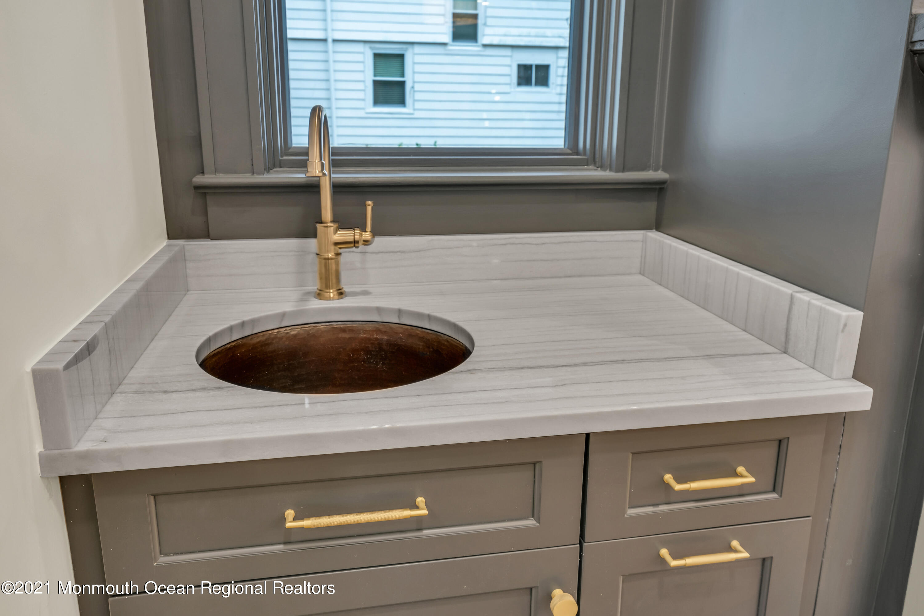 222 Cedar Avenue Allenhurst, NJ 07711 - Photo 18 of 73 a bathroom with a sink and a mirror