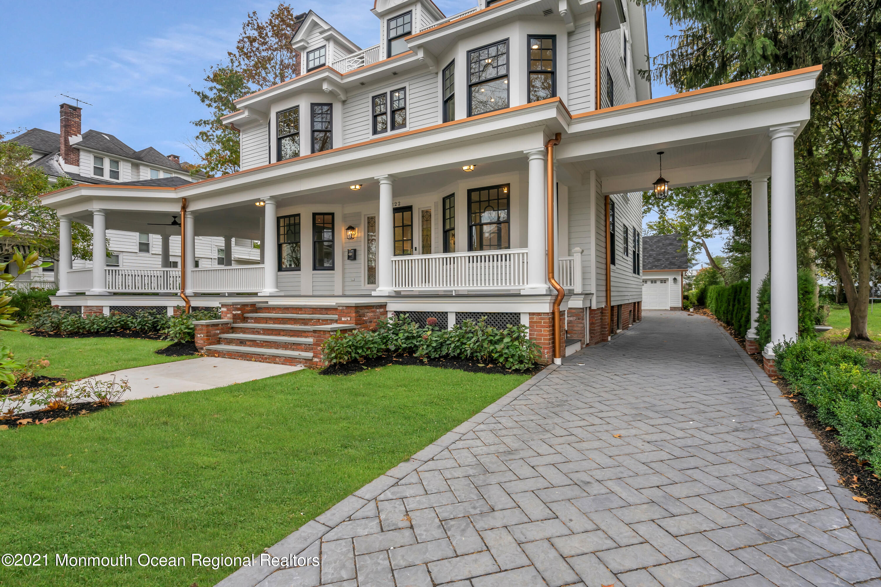 222 Cedar Avenue Allenhurst, NJ 07711 - Photo 3 of 73 a front view of a house with a yard