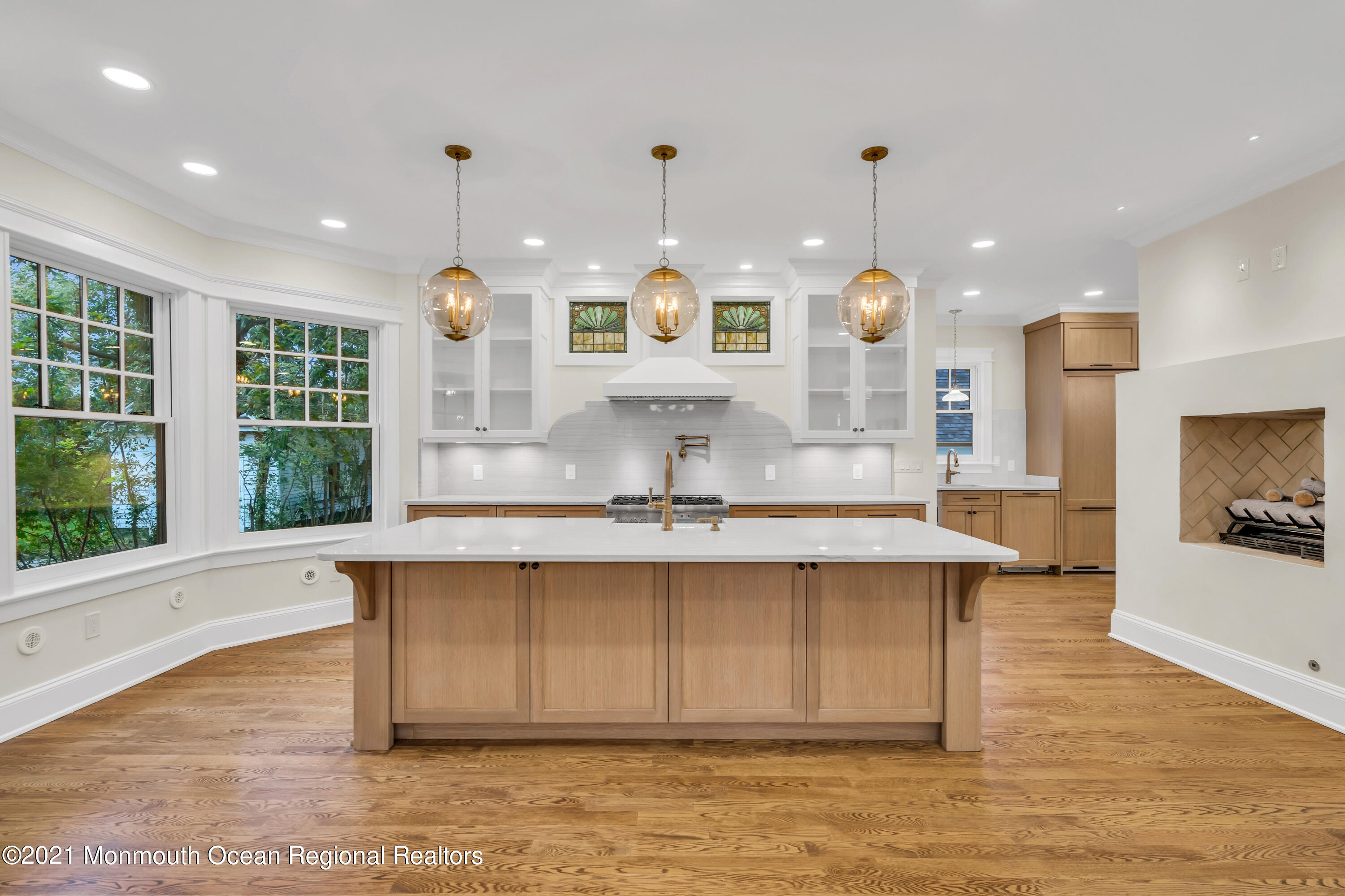 222 Cedar Avenue Allenhurst, NJ 07711 - Photo 21 of 73 a large kitchen with a large counter top a sink stainless steel appliances and cabinets