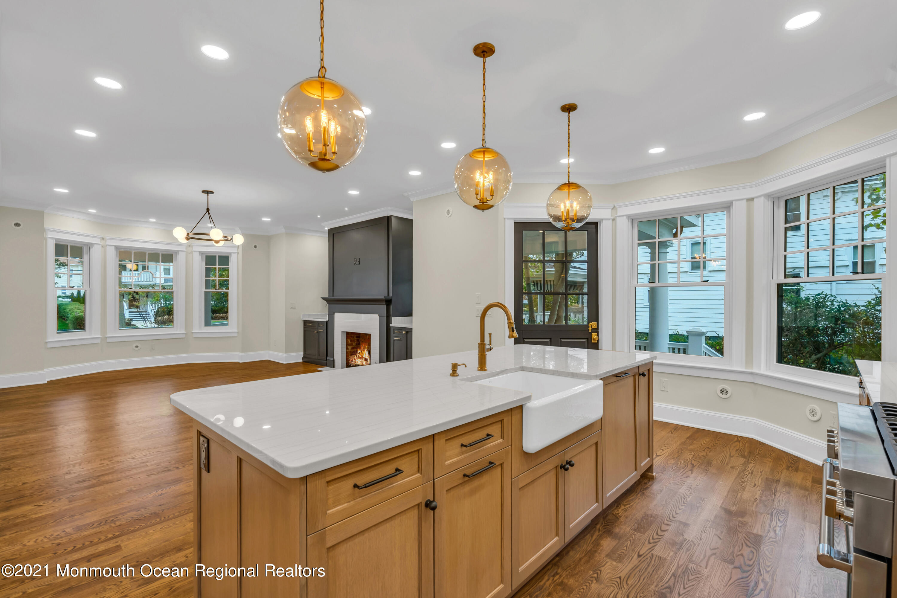 222 Cedar Avenue Allenhurst, NJ 07711 - Photo 24 of 73 a large kitchen with kitchen island a large island in it