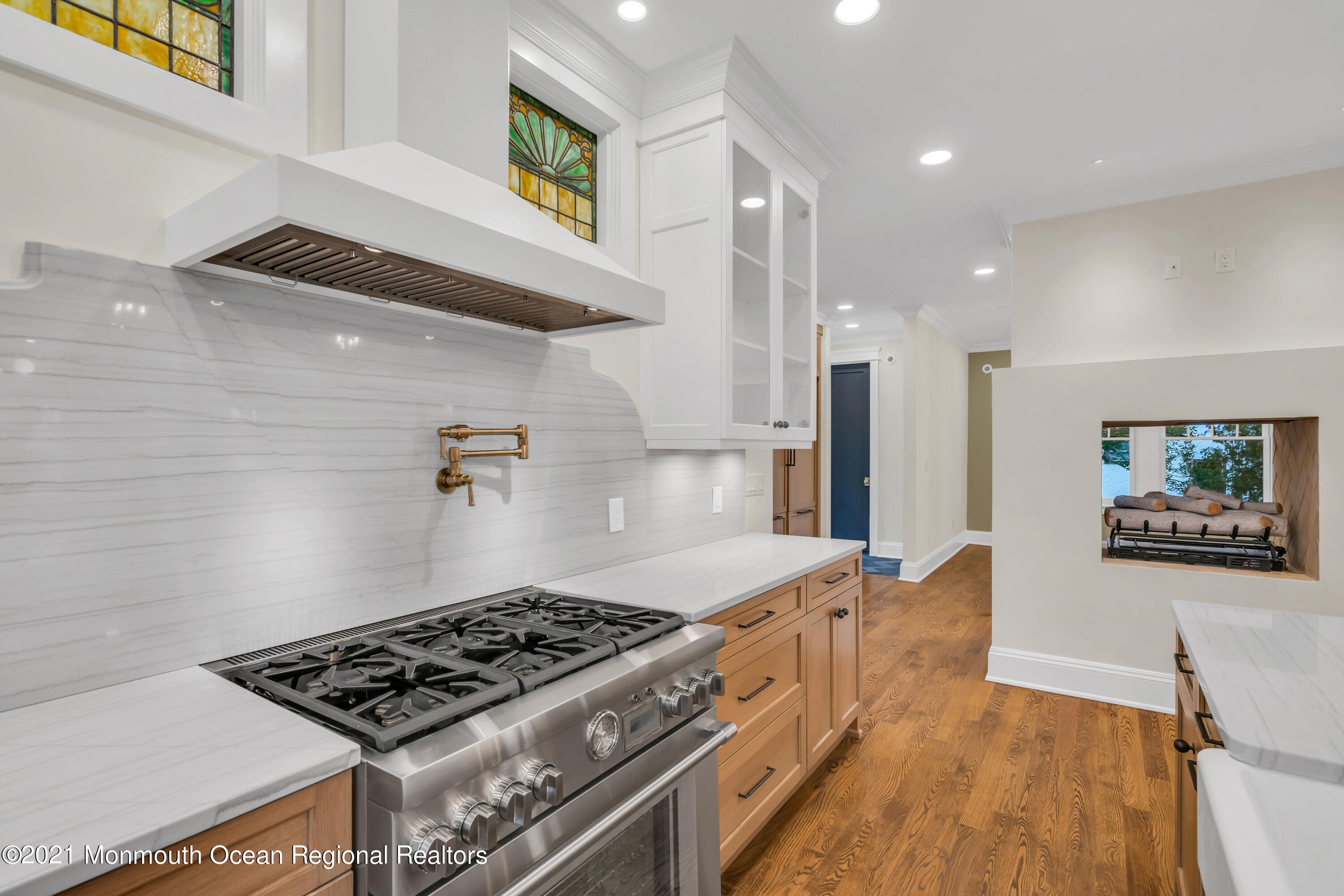 222 Cedar Avenue Allenhurst, NJ 07711 - Photo 27 of 73 a kitchen with stainless steel appliances granite countertop a stove and a refrigerator