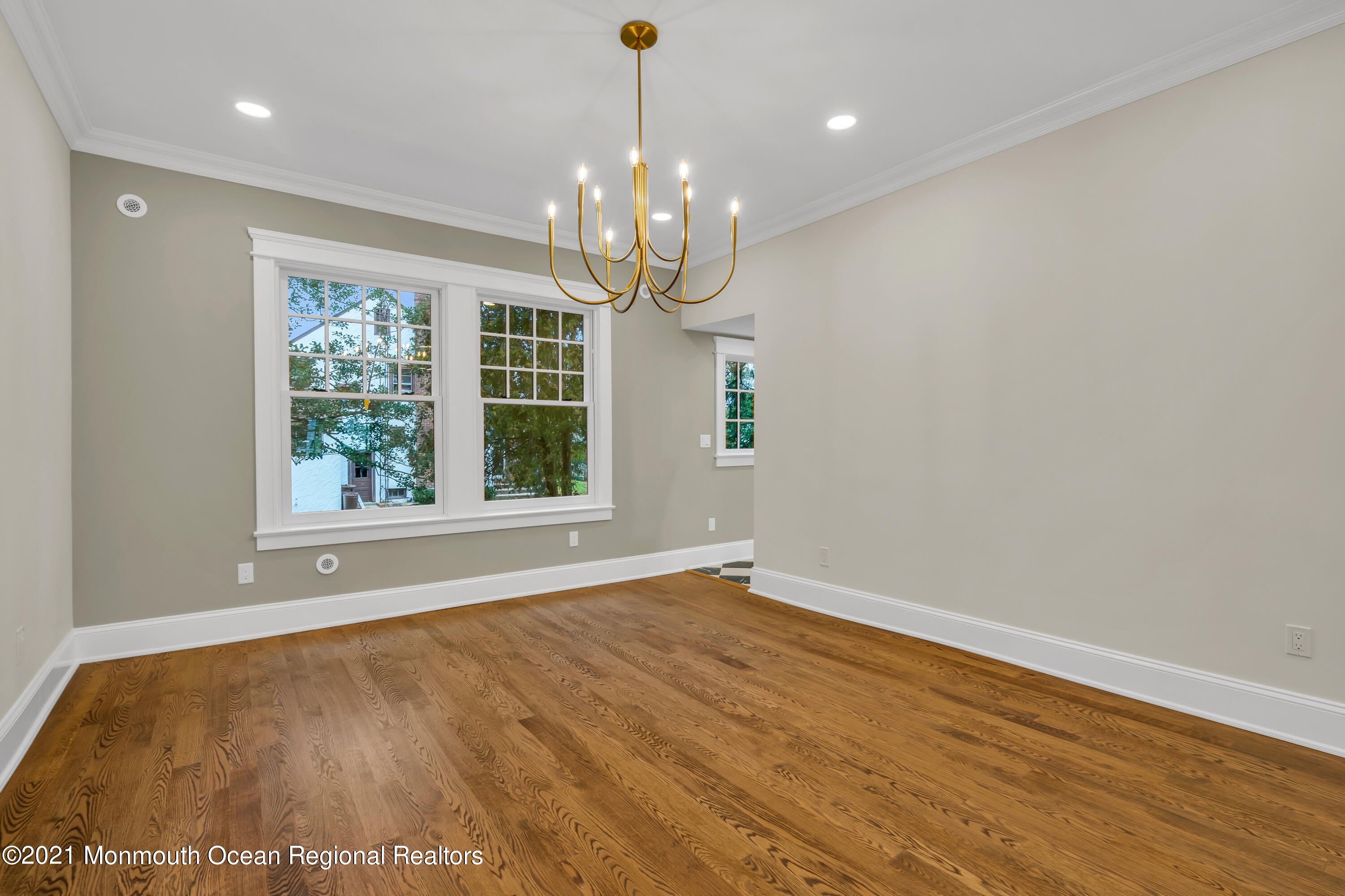 222 Cedar Avenue Allenhurst, NJ 07711 - Photo 31 of 73 a view of an empty room with wooden floor and a window