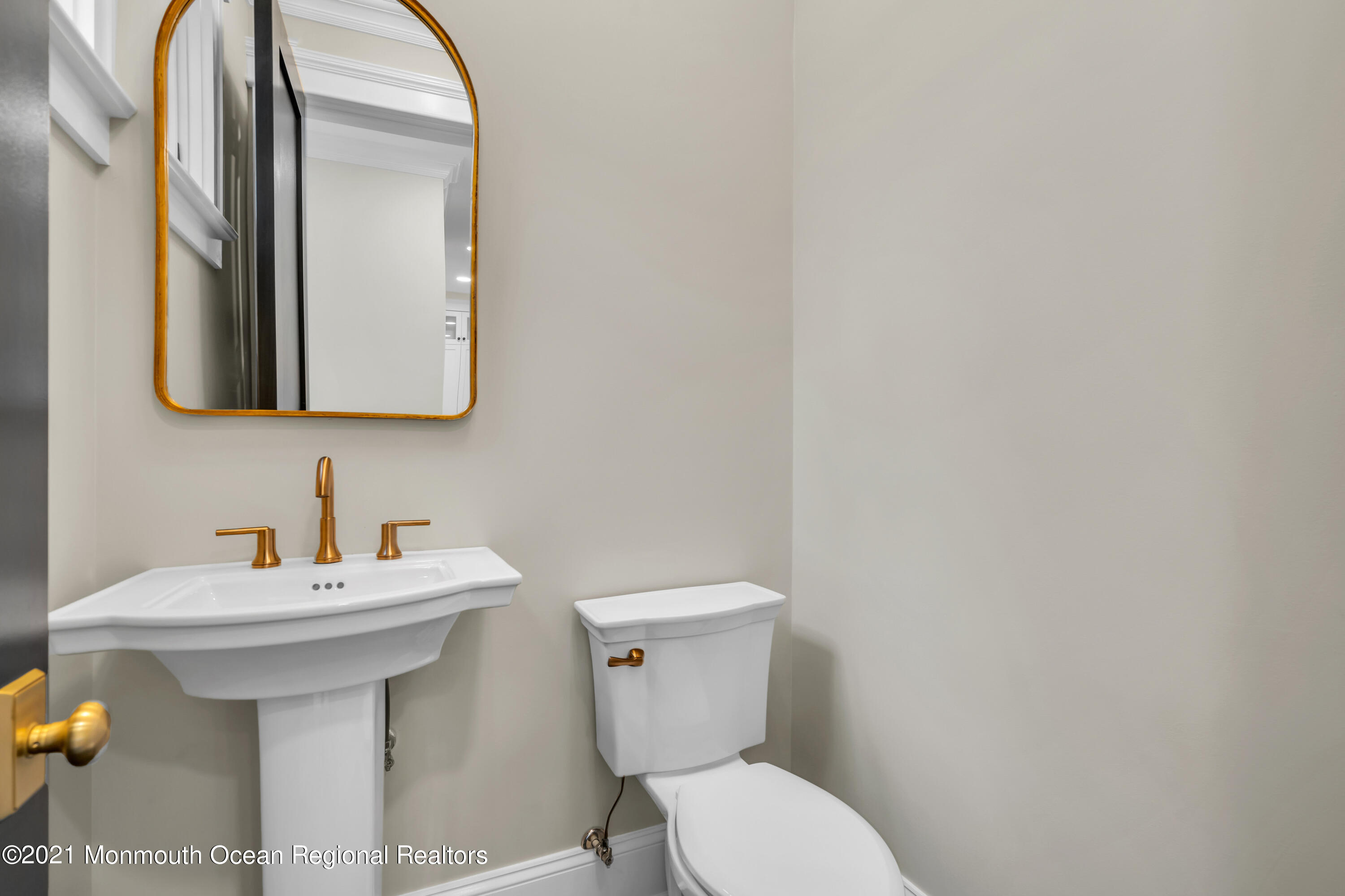 222 Cedar Avenue Allenhurst, NJ 07711 - Photo 32 of 73 a bathroom with a sink mirror and toilet