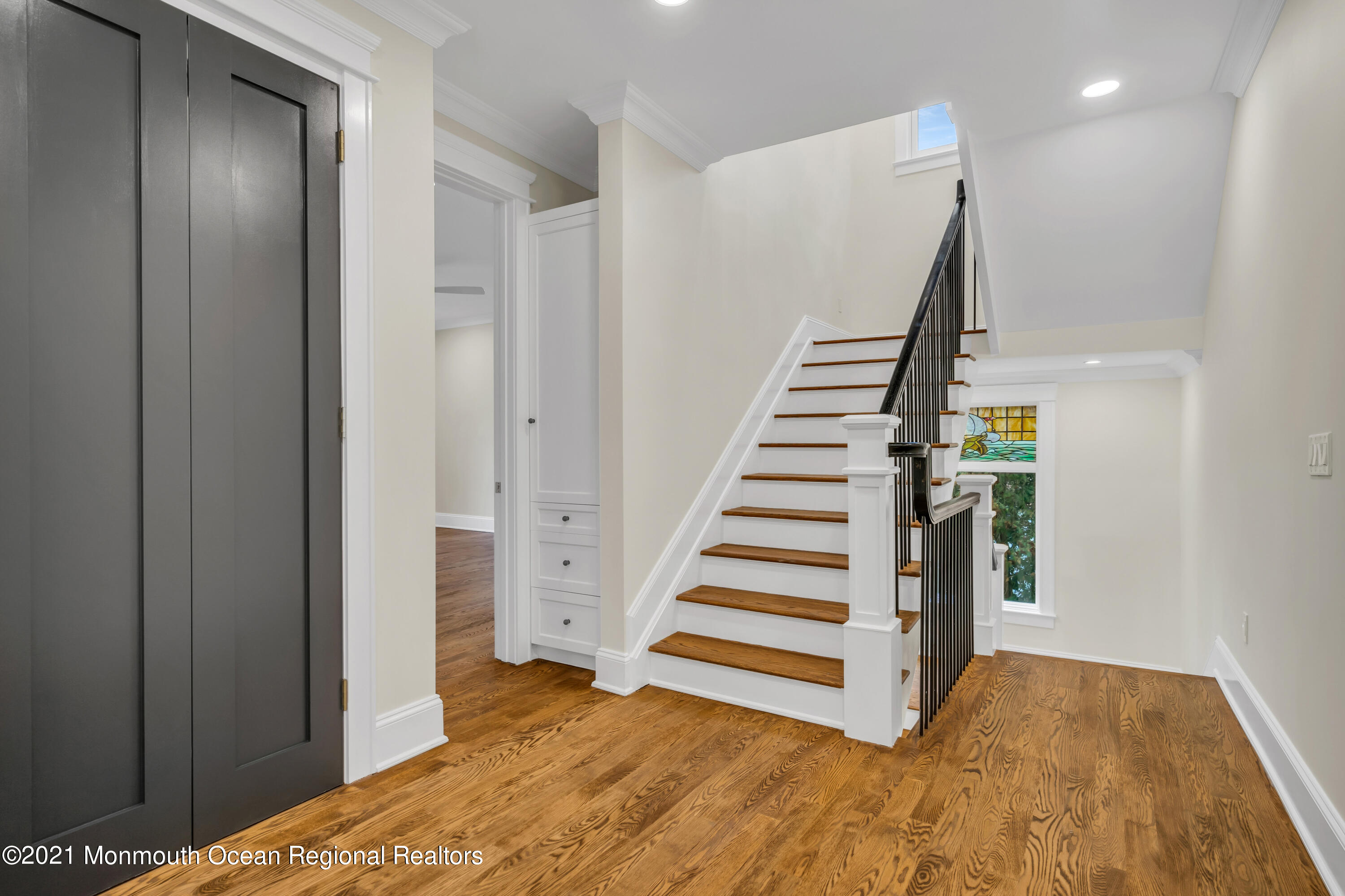 222 Cedar Avenue Allenhurst, NJ 07711 - Photo 34 of 73 a view of a bedroom with wooden floor and stairs