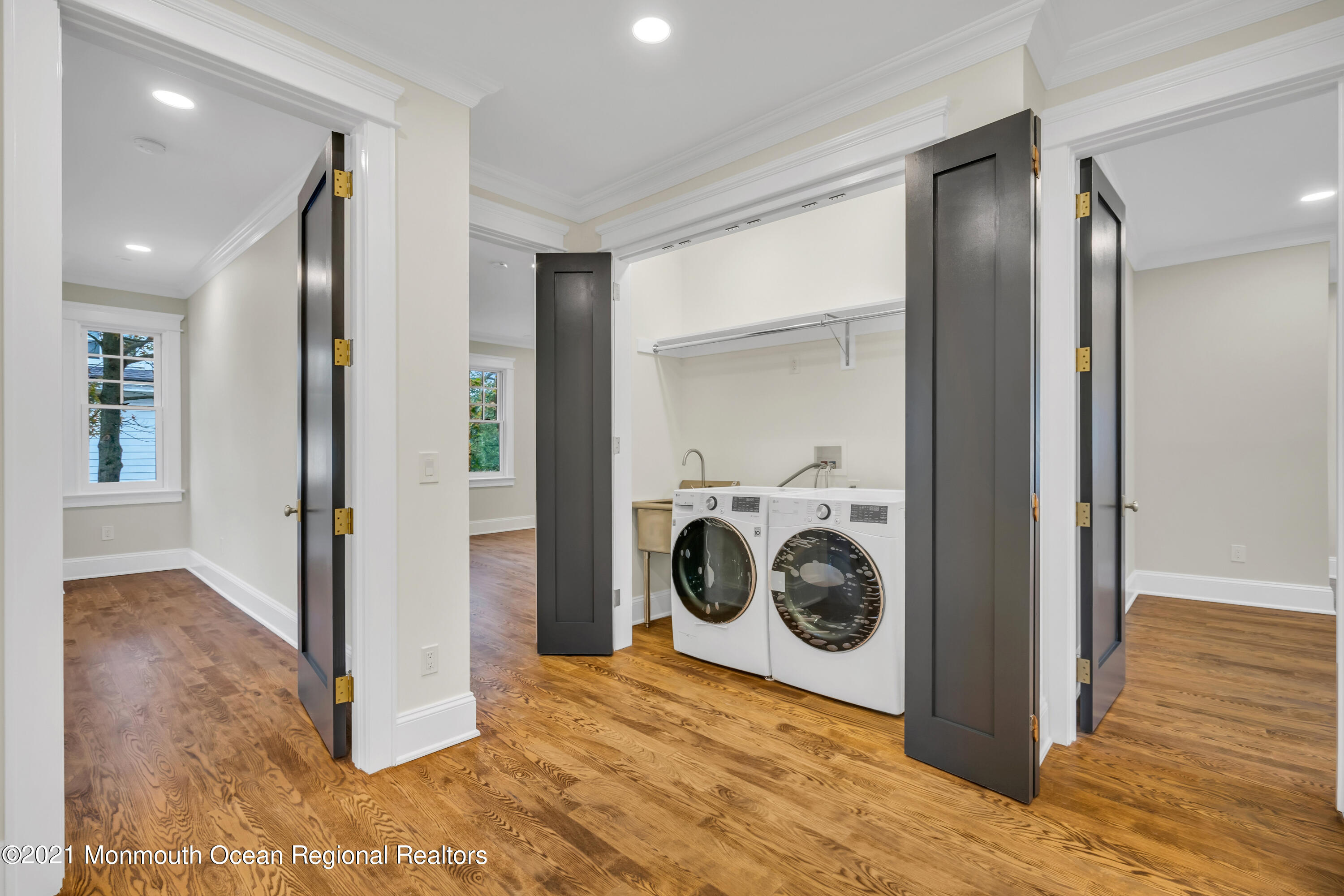 222 Cedar Avenue Allenhurst, NJ 07711 - Photo 36 of 73 a view of a hallway with washer and dryer