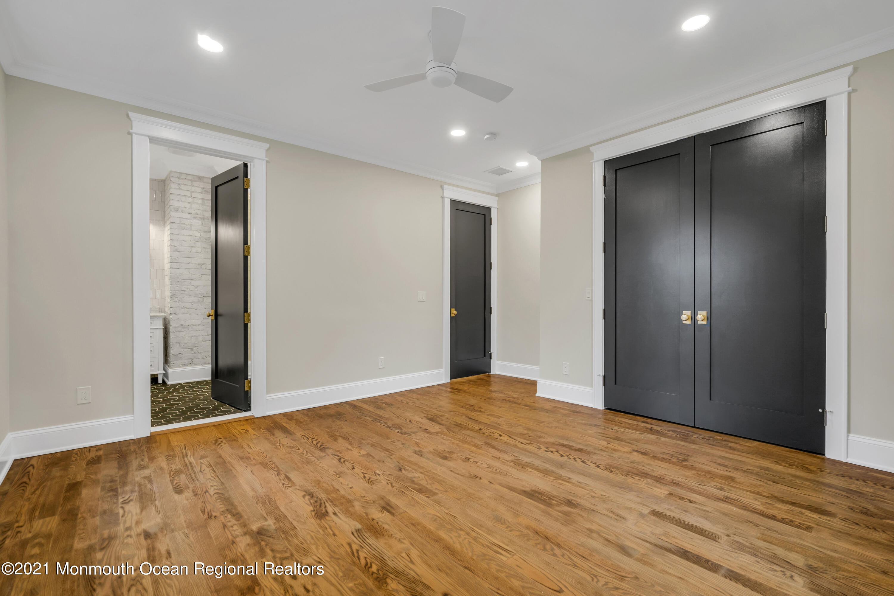 222 Cedar Avenue Allenhurst, NJ 07711 - Photo 38 of 73 a view of empty room with wooden floor