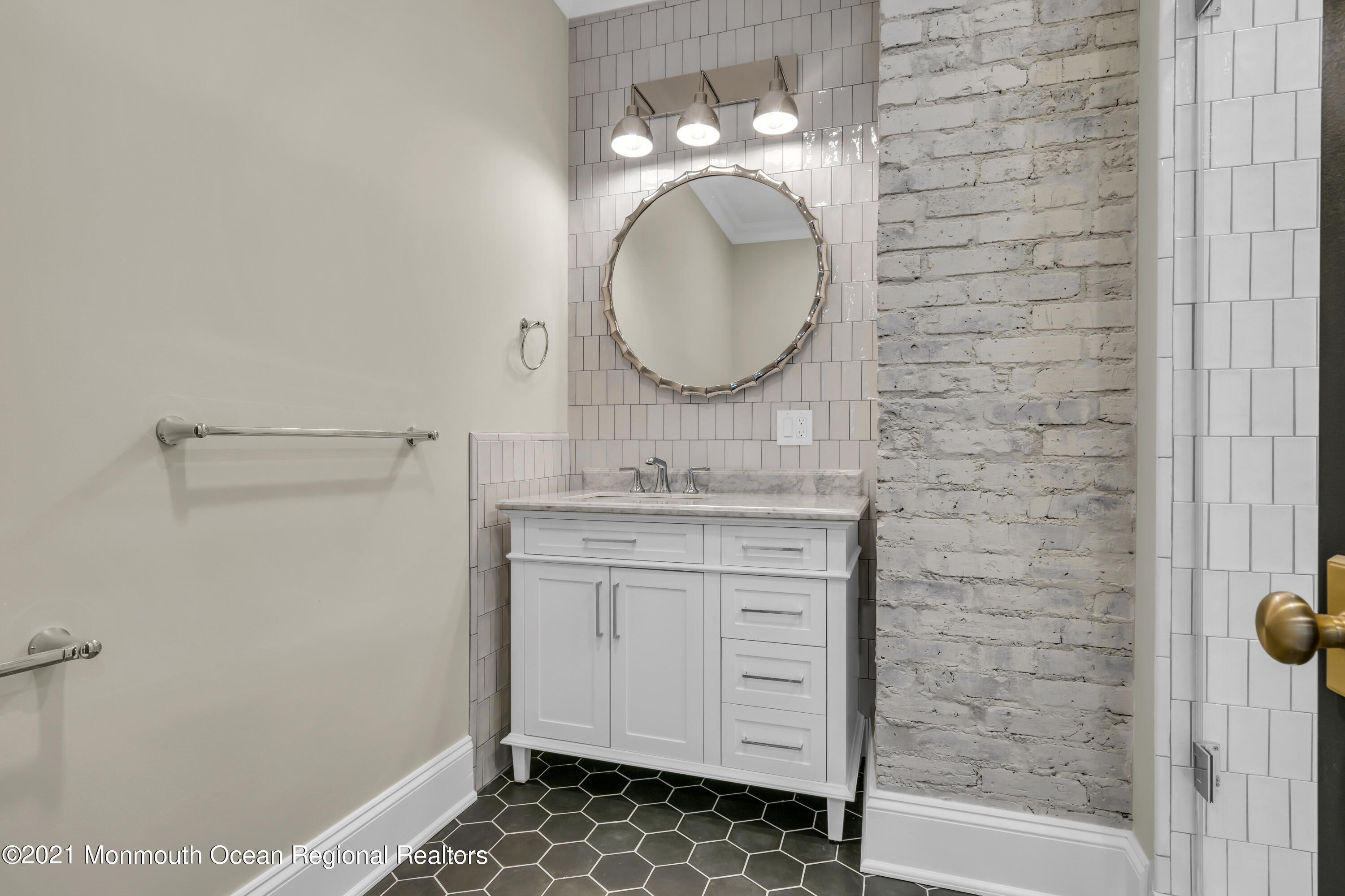 222 Cedar Avenue Allenhurst, NJ 07711 - Photo 39 of 73 a bathroom with a sink and a mirror