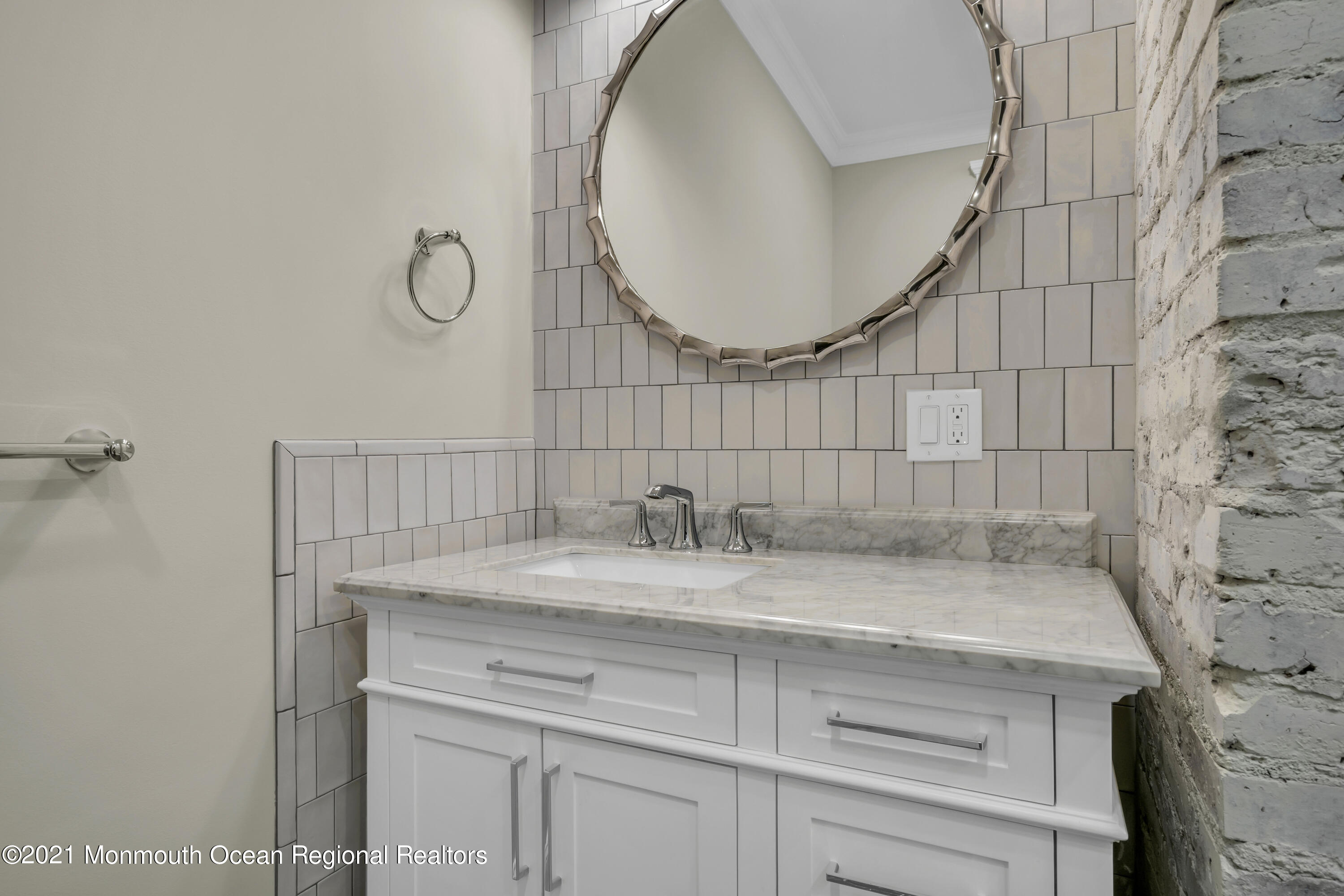 222 Cedar Avenue Allenhurst, NJ 07711 - Photo 40 of 73 a bathroom with a sink and a mirror