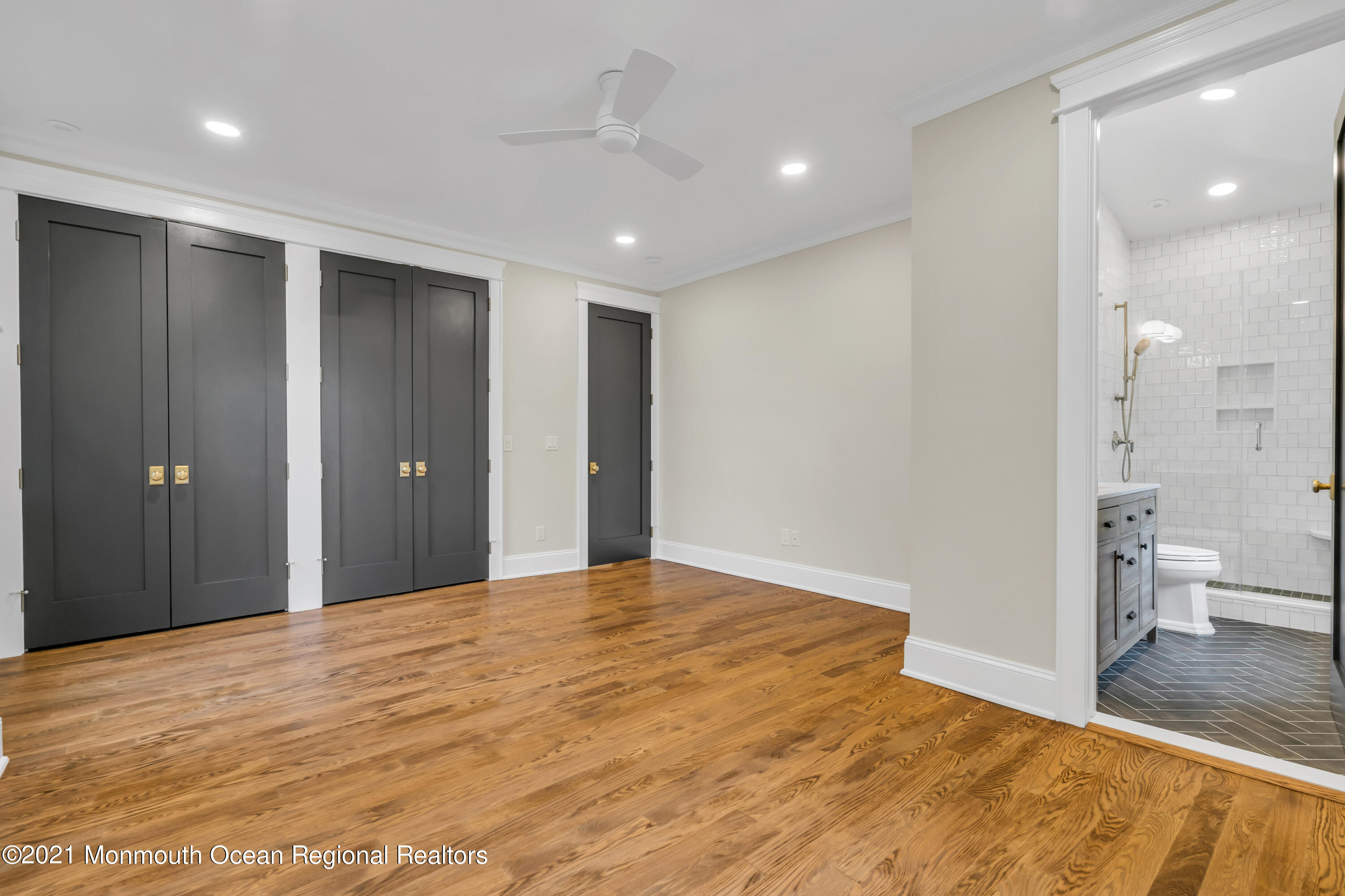 222 Cedar Avenue Allenhurst, NJ 07711 - Photo 43 of 73 a big room with wooden floor and a bathroom