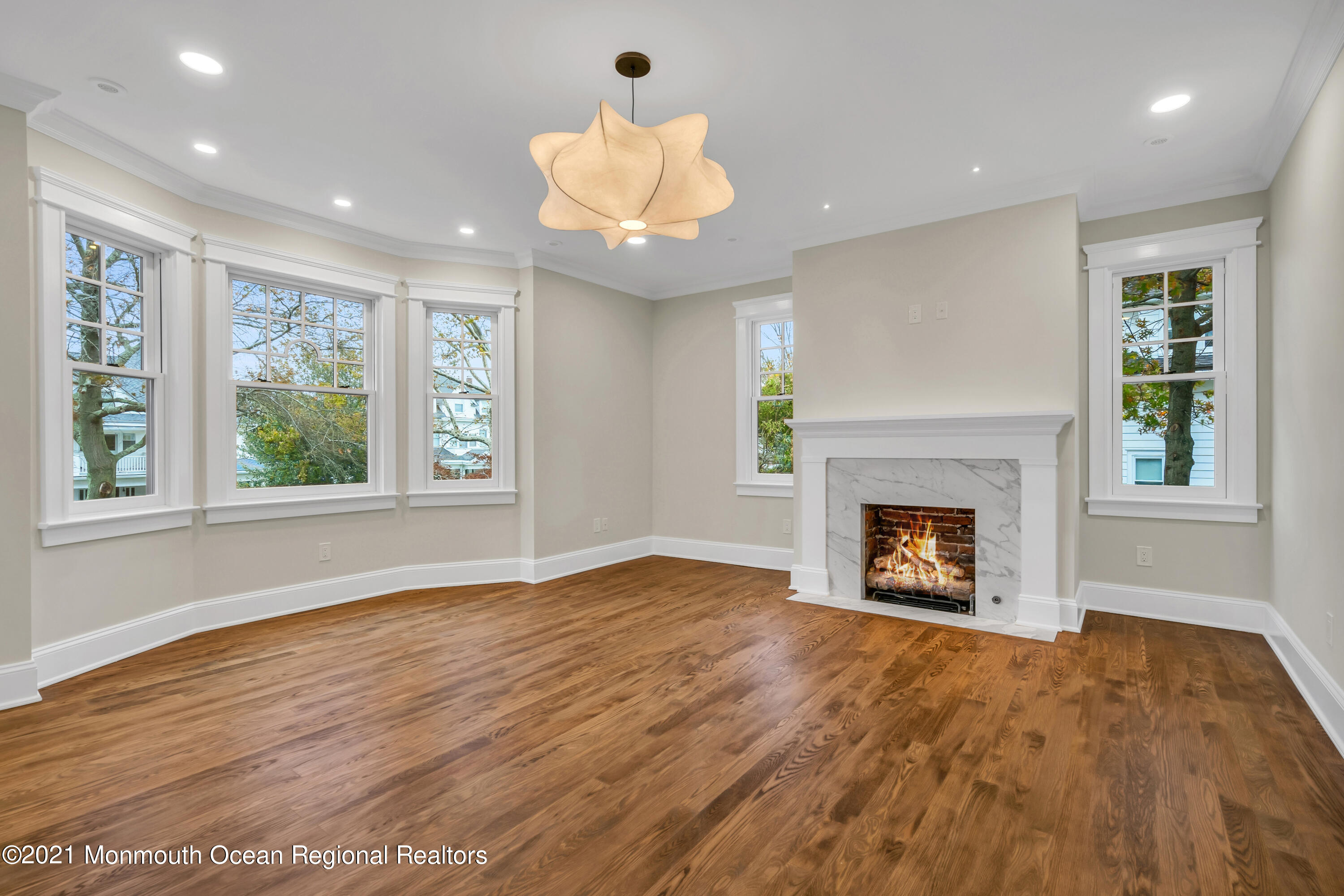 222 Cedar Avenue Allenhurst, NJ 07711 - Photo 45 of 73 a view of an empty room with a window and fire place