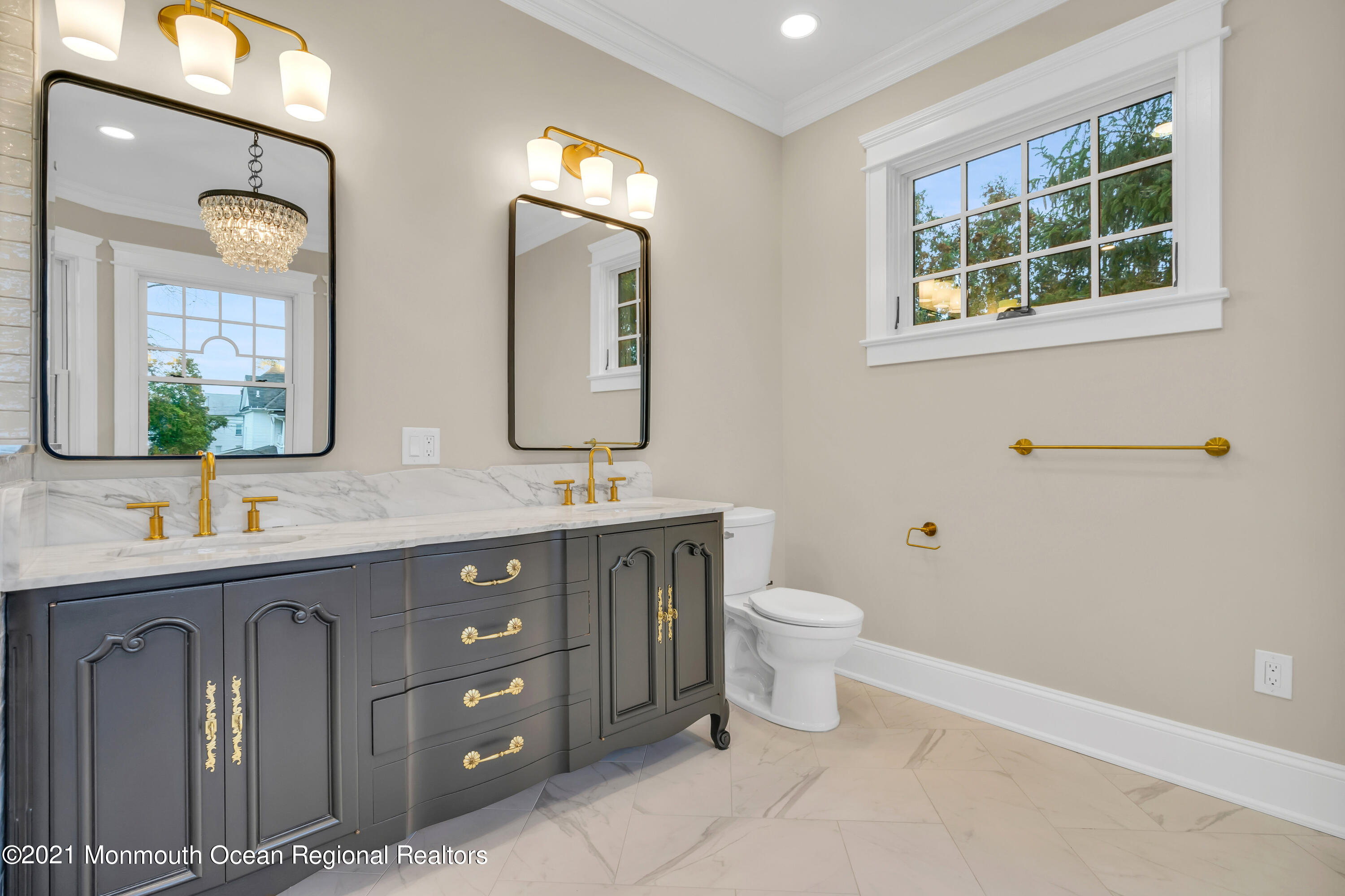 222 Cedar Avenue Allenhurst, NJ 07711 - Photo 50 of 73 a bathroom with a double vanity sink a toilet and a mirror