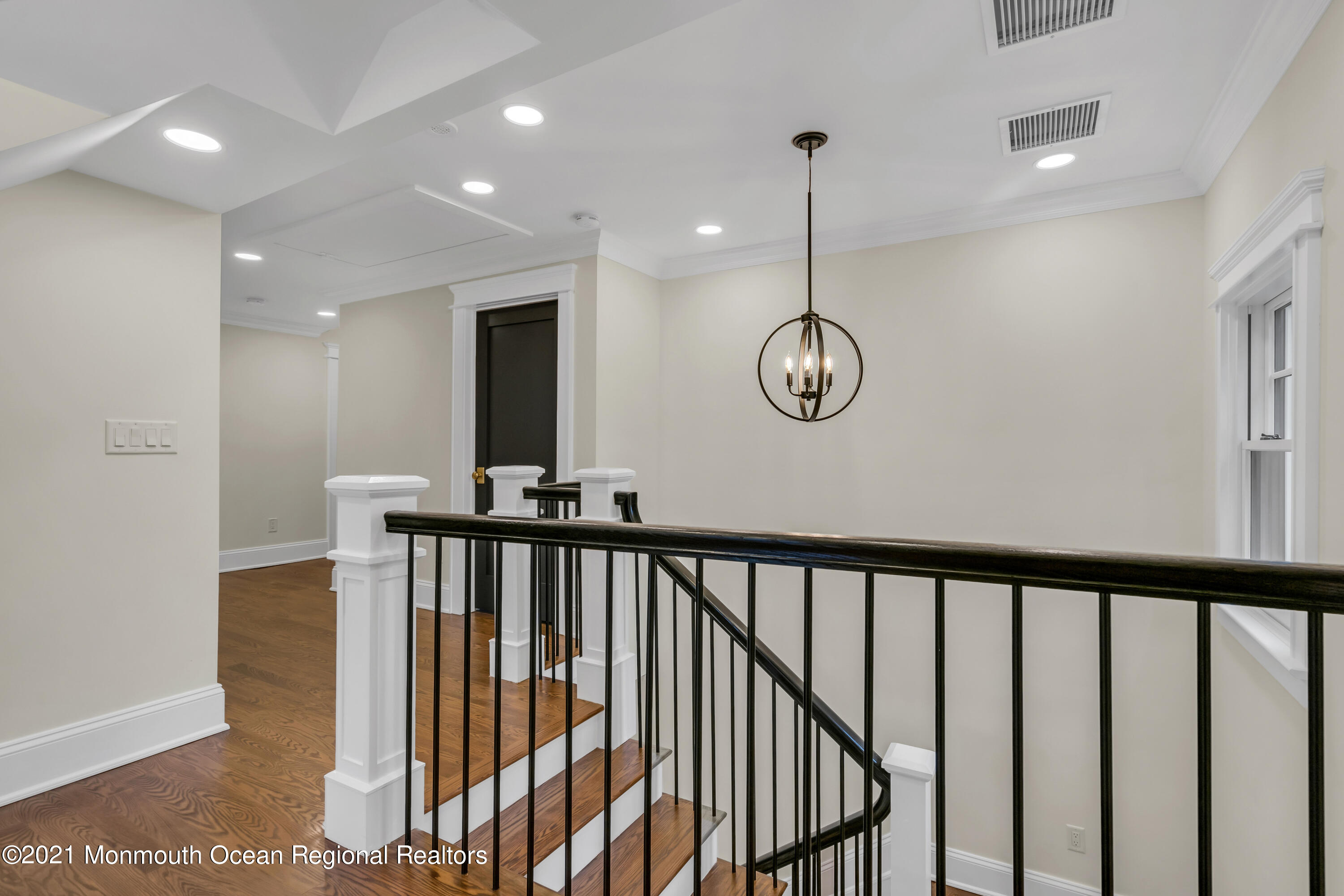 222 Cedar Avenue Allenhurst, NJ 07711 - Photo 54 of 73 a view of a hallway with wooden floor and staircase