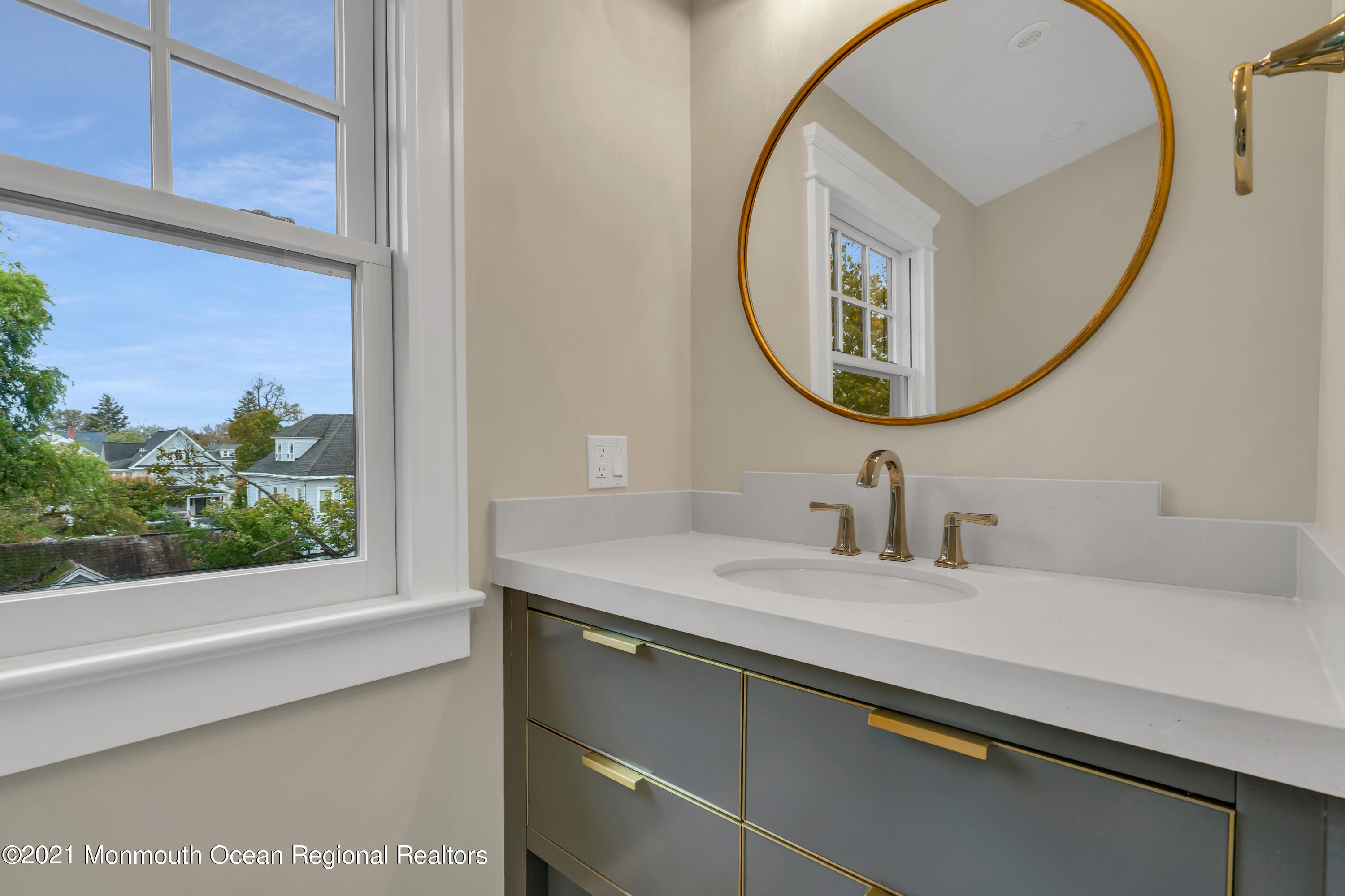 222 Cedar Avenue Allenhurst, NJ 07711 - Photo 61 of 73 a bathroom with a sink and a mirror