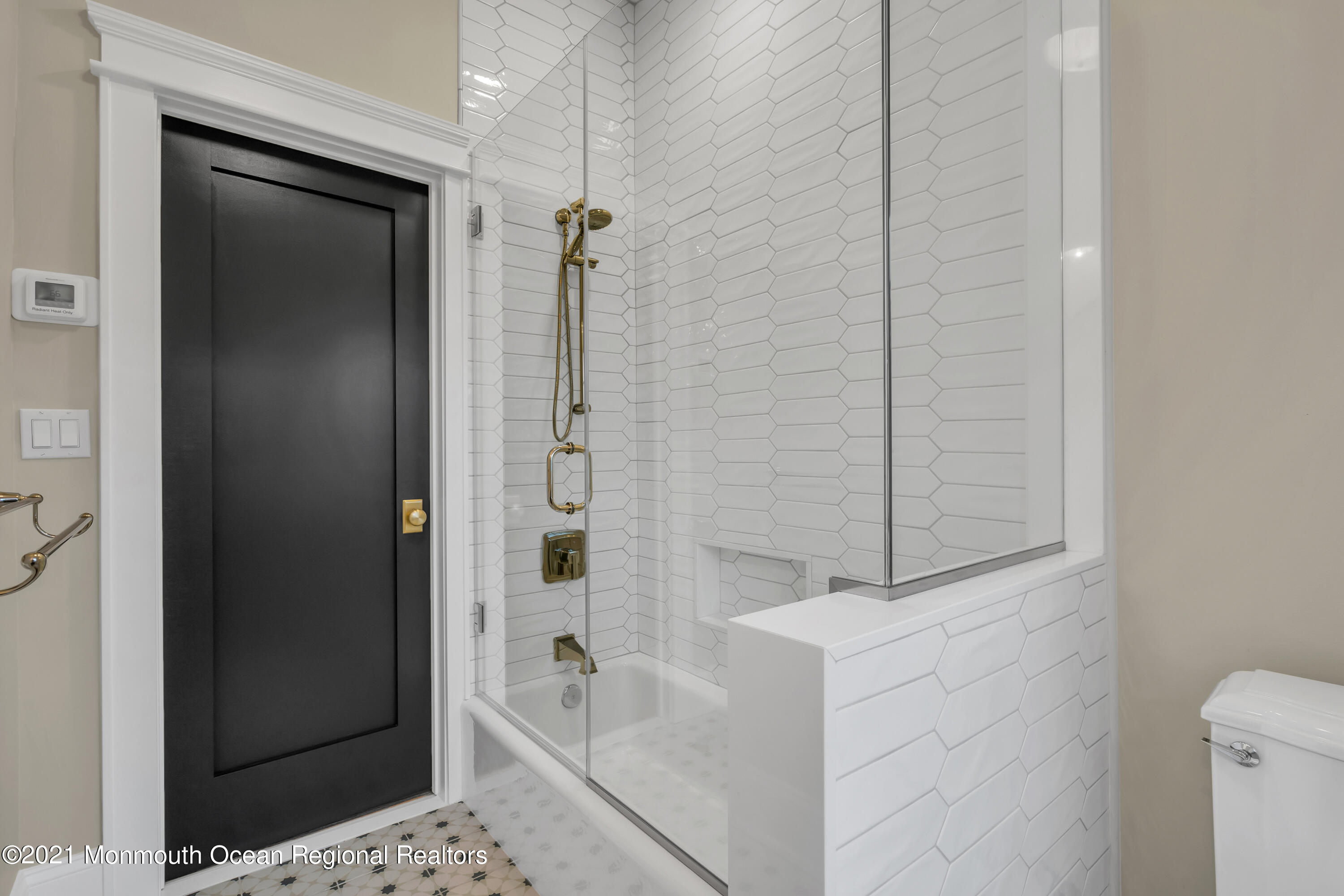 222 Cedar Avenue Allenhurst, NJ 07711 - Photo 62 of 73 a bathroom with a bathtub and a shower