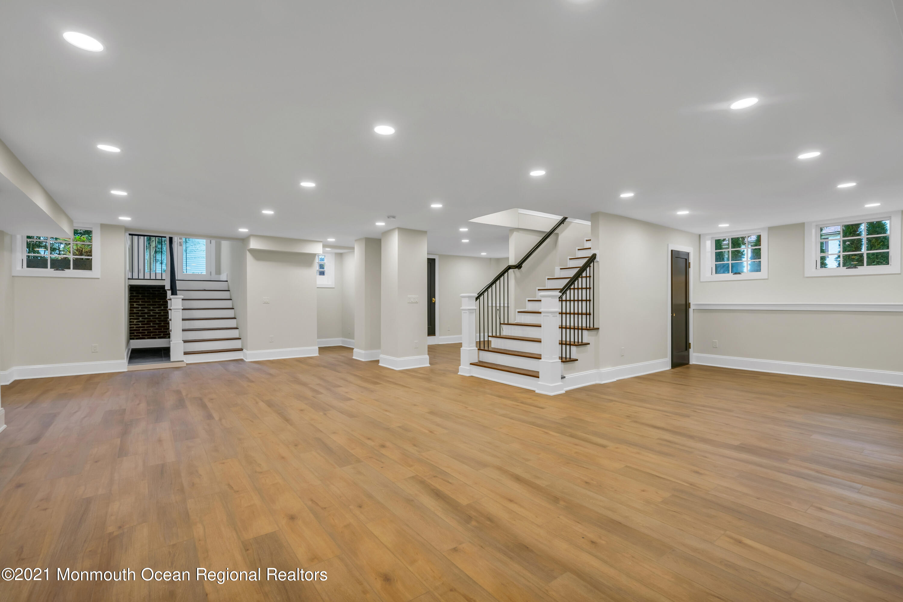 222 Cedar Avenue Allenhurst, NJ 07711 - Photo 65 of 73 a view of an empty room with wooden floor