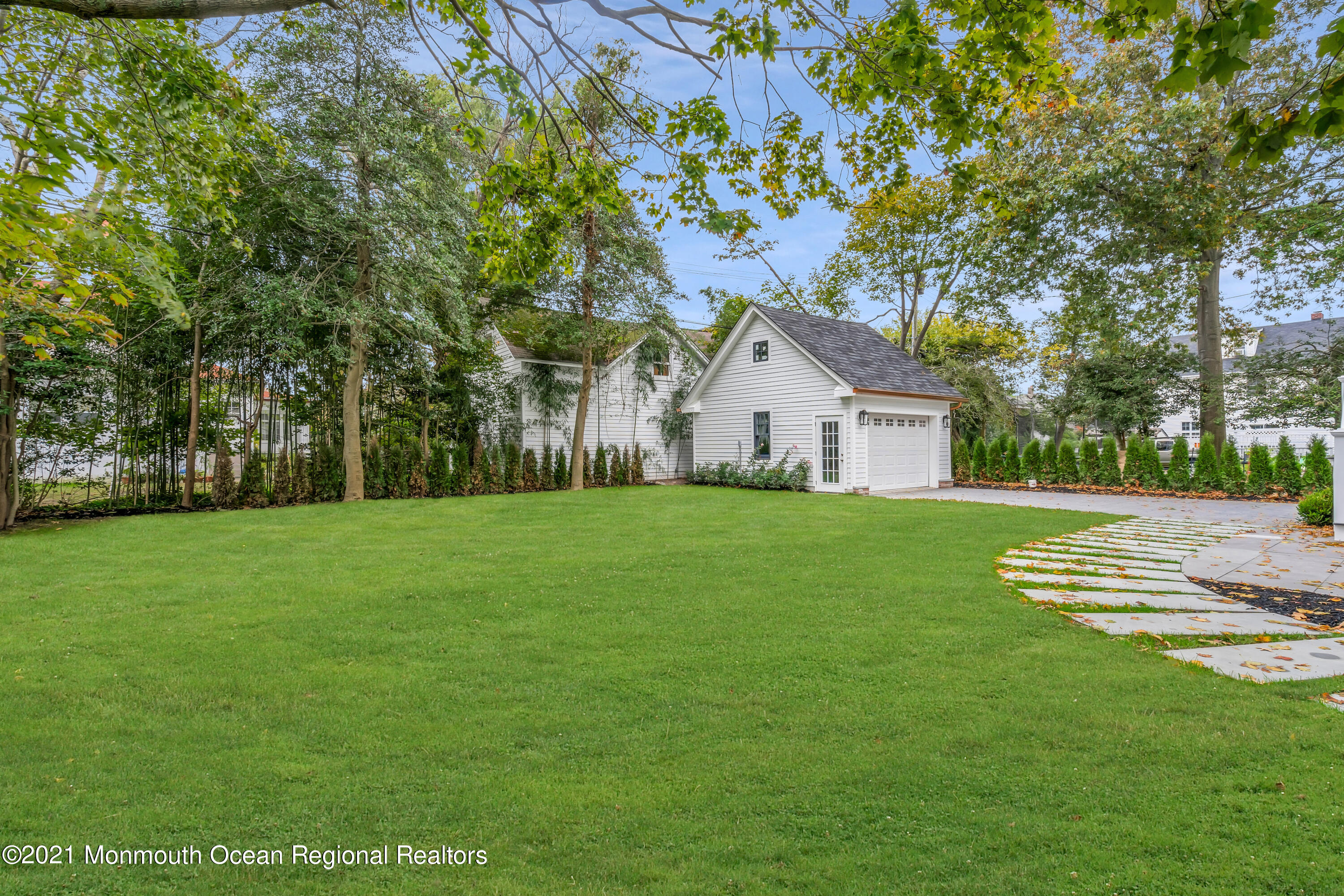 222 Cedar Avenue Allenhurst, NJ 07711 - Photo 67 of 73 a front view of house with yard and green space