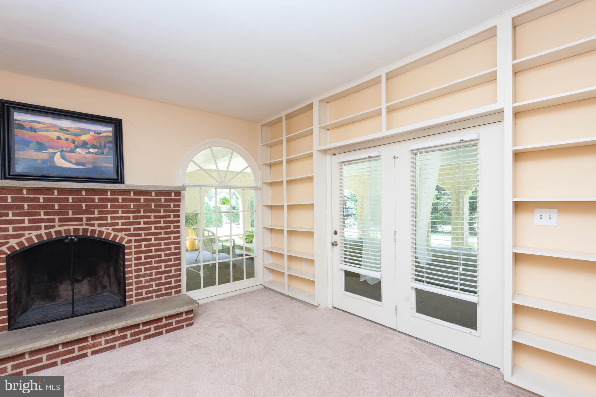 1656 Comanche Road Arnold, MD 21012 - Photo 15 of 30 Library with fireplace looks out to Piazza.