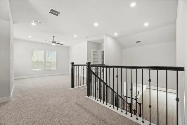 a view of an empty room with stairs