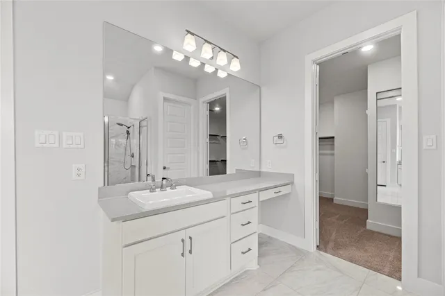 a bathroom with a sink double vanity and a mirror