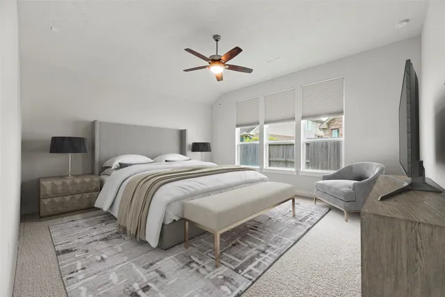 a bedroom with a bed and glass window