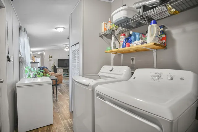 a bedroom with a bed and a chair in it