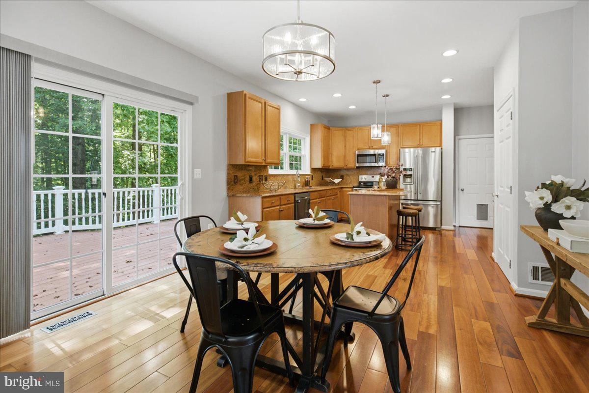 2424 Springbrook Court Huntingtown, MD 20639 - Photo 29 of 103 a view of a dining room with furniture window and outside view