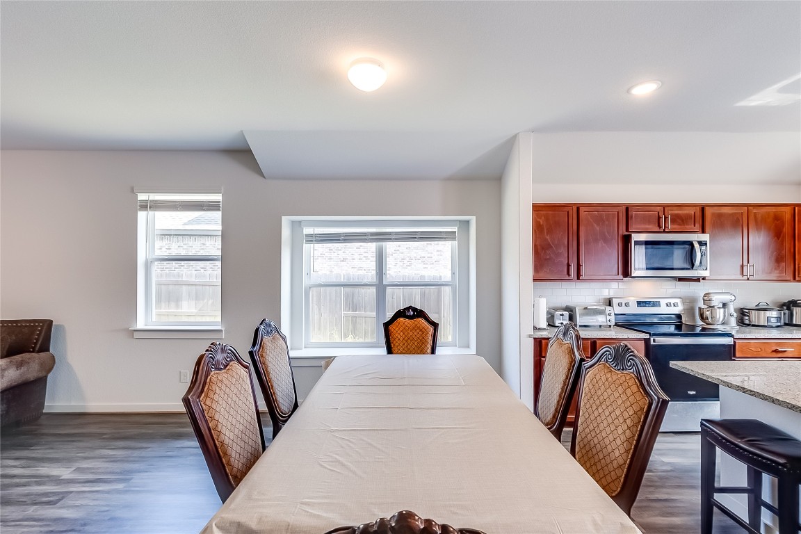 1104 Terrace View Georgetown, TX 78628 - Photo 11 of 36 a bedroom with a bed a large window and wooden floor