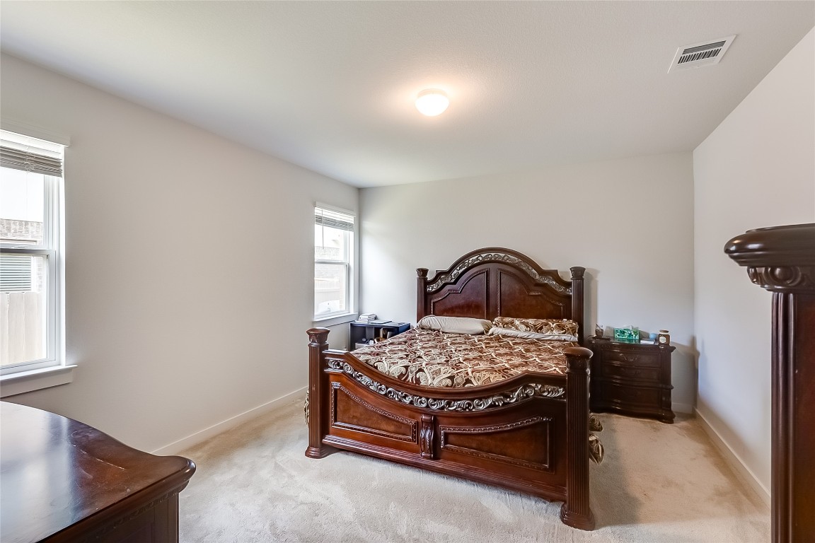 1104 Terrace View Georgetown, TX 78628 - Photo 13 of 36 a bedroom with a bed and a window