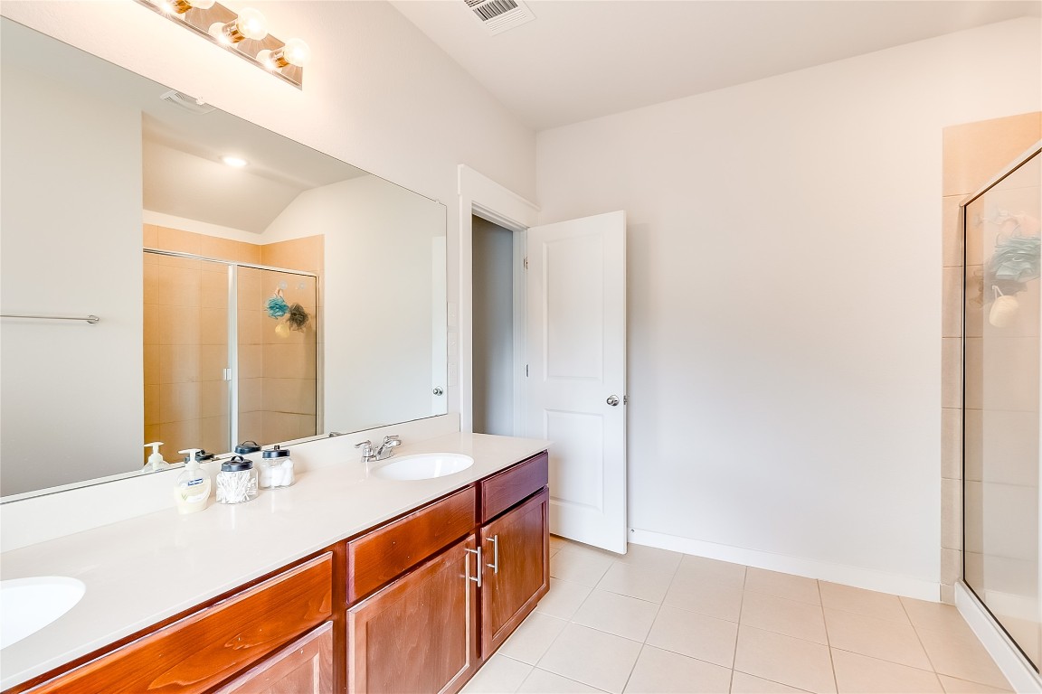 1104 Terrace View Georgetown, TX 78628 - Photo 17 of 36 a bathroom with a sink and a mirror