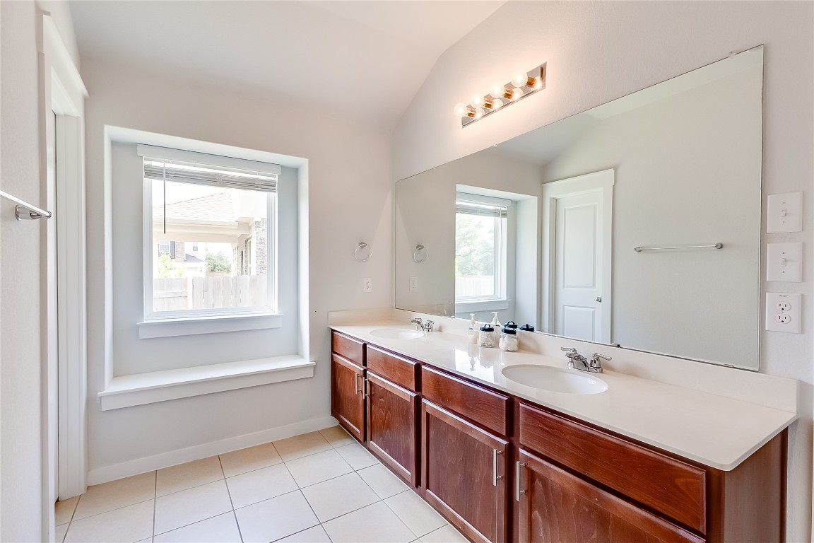 1104 Terrace View Georgetown, TX 78628 - Photo 18 of 36 a bathroom with a sink double vanity and a mirror