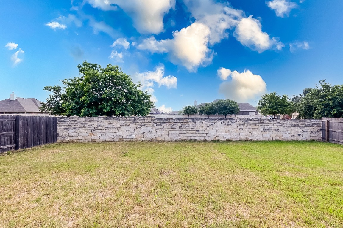 1104 Terrace View Georgetown, TX 78628 - Photo 26 of 36 a view of a swimming pool and a yard