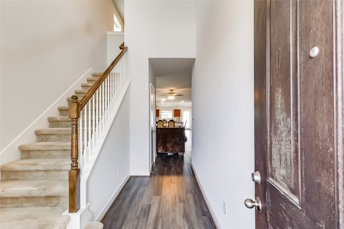 1104 Terrace View Georgetown, TX 78628 - Photo 4 of 36 a view of a hallway with wooden floor and staircase