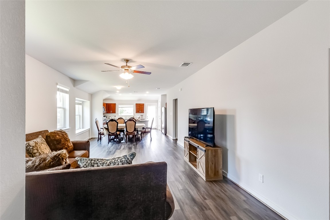 1104 Terrace View Georgetown, TX 78628 - Photo 5 of 36 a living room with fireplace furniture and a flat screen tv