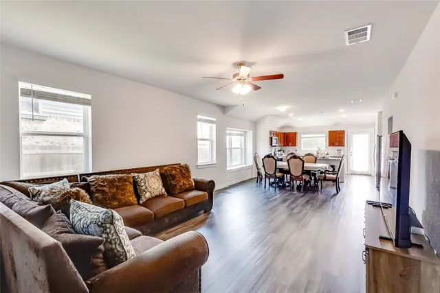 a view of a livingroom with furniture and a window