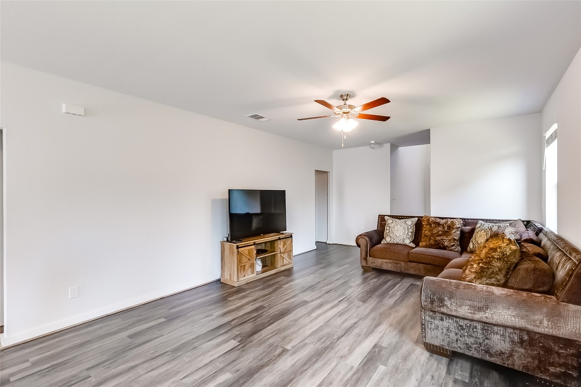 1104 Terrace View Georgetown, TX 78628 - Photo 8 of 36 a living room with furniture and a flat screen tv