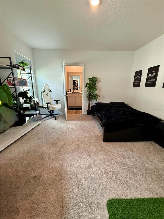3222 Bitterroot Lane Bradenton, FL 34211 - Photo 10 of 12 a living room with furniture and a lamp